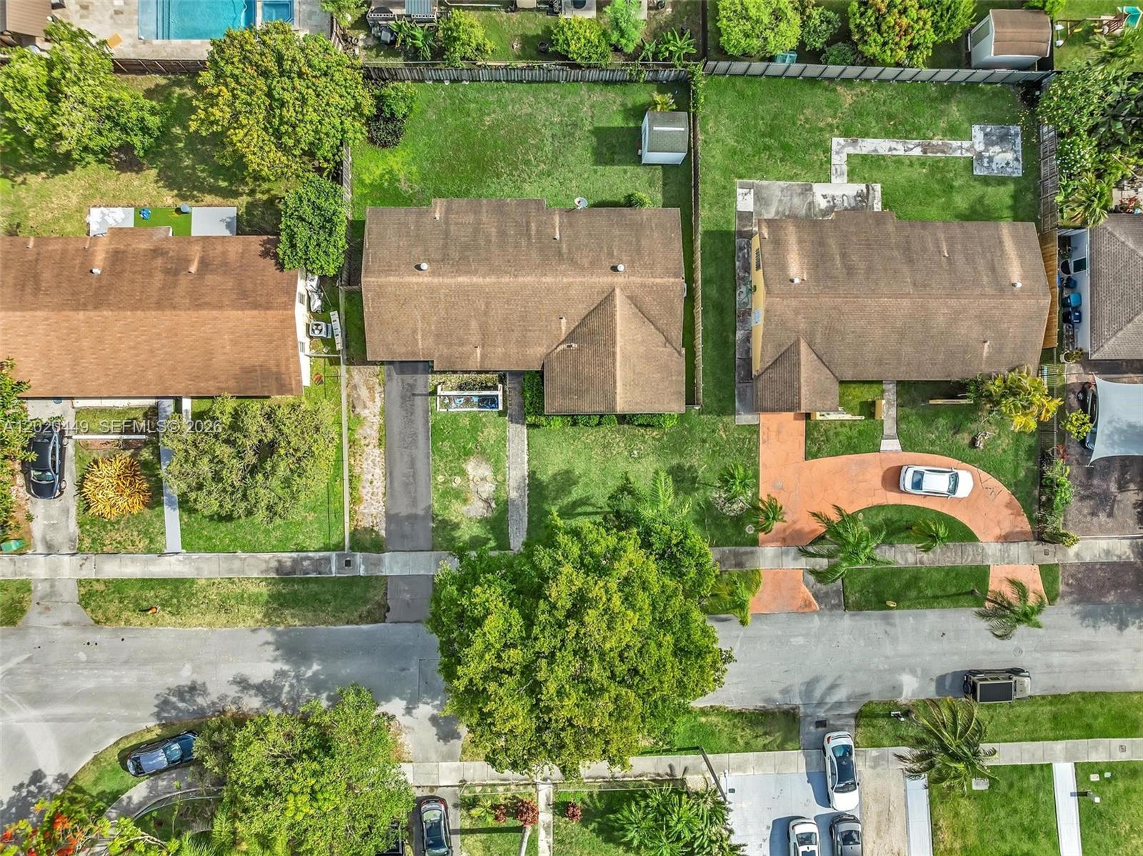 11061 Southwest 163rd Street Miami, FL 33157 - Photo 41 of 42 an aerial view of a house with a yard and outdoor seating