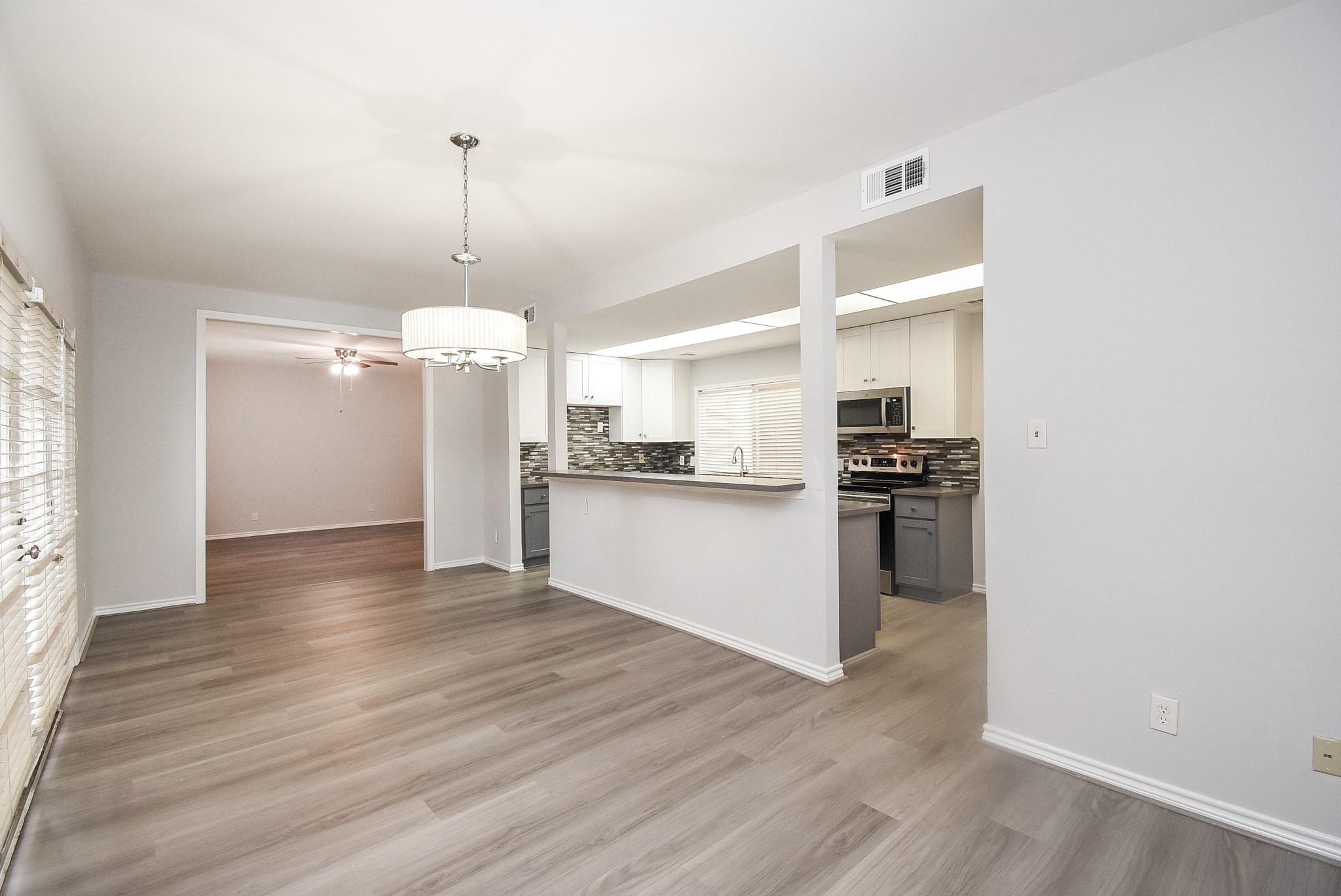 201 Vanderpool Lane, Unit 113 Houston, TX 77024 - Photo 11 of 45 a view of kitchen with granite countertop cabinets and refrigerator