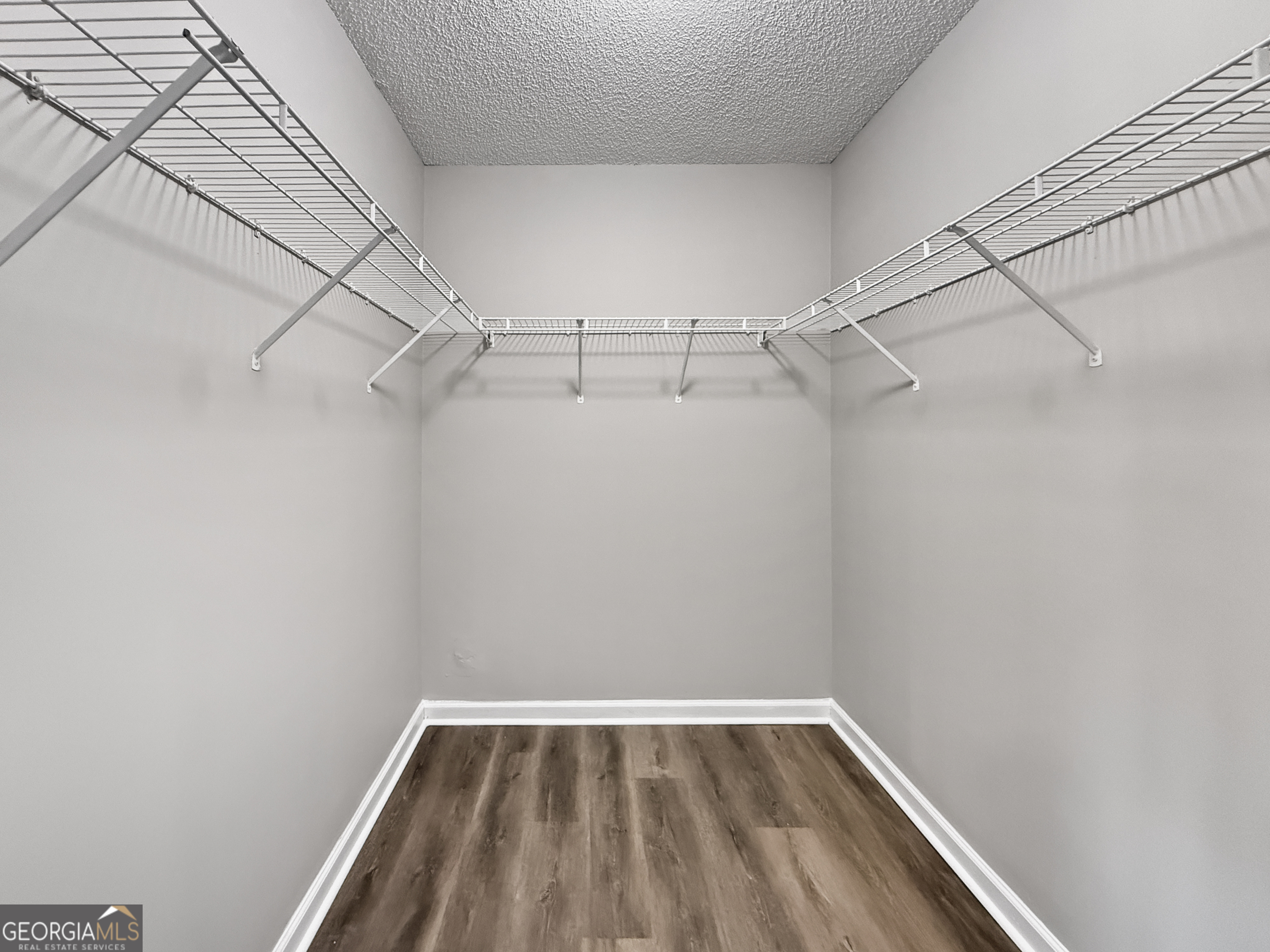 231 Ferguson Avenue Locust Grove, GA 30248 - Photo 12 of 26 a view of a room with racks on the wall