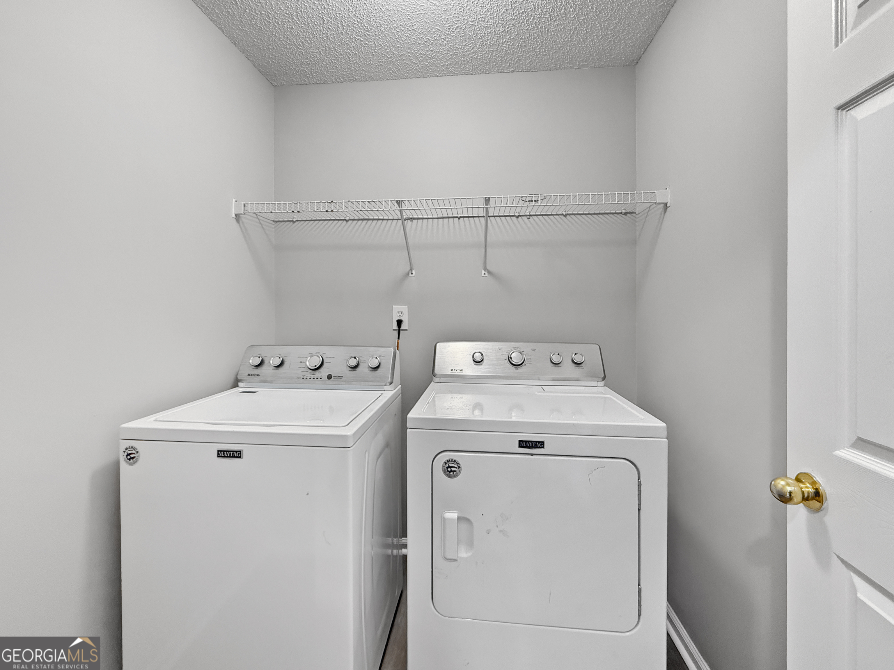 231 Ferguson Avenue Locust Grove, GA 30248 - Photo 20 of 26 a utility room with dryer and washer