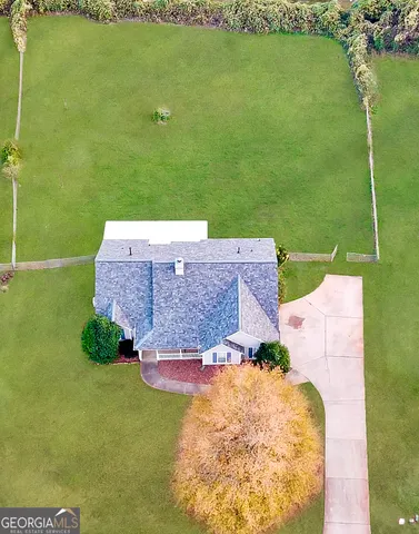 a aerial view of a house with a garden