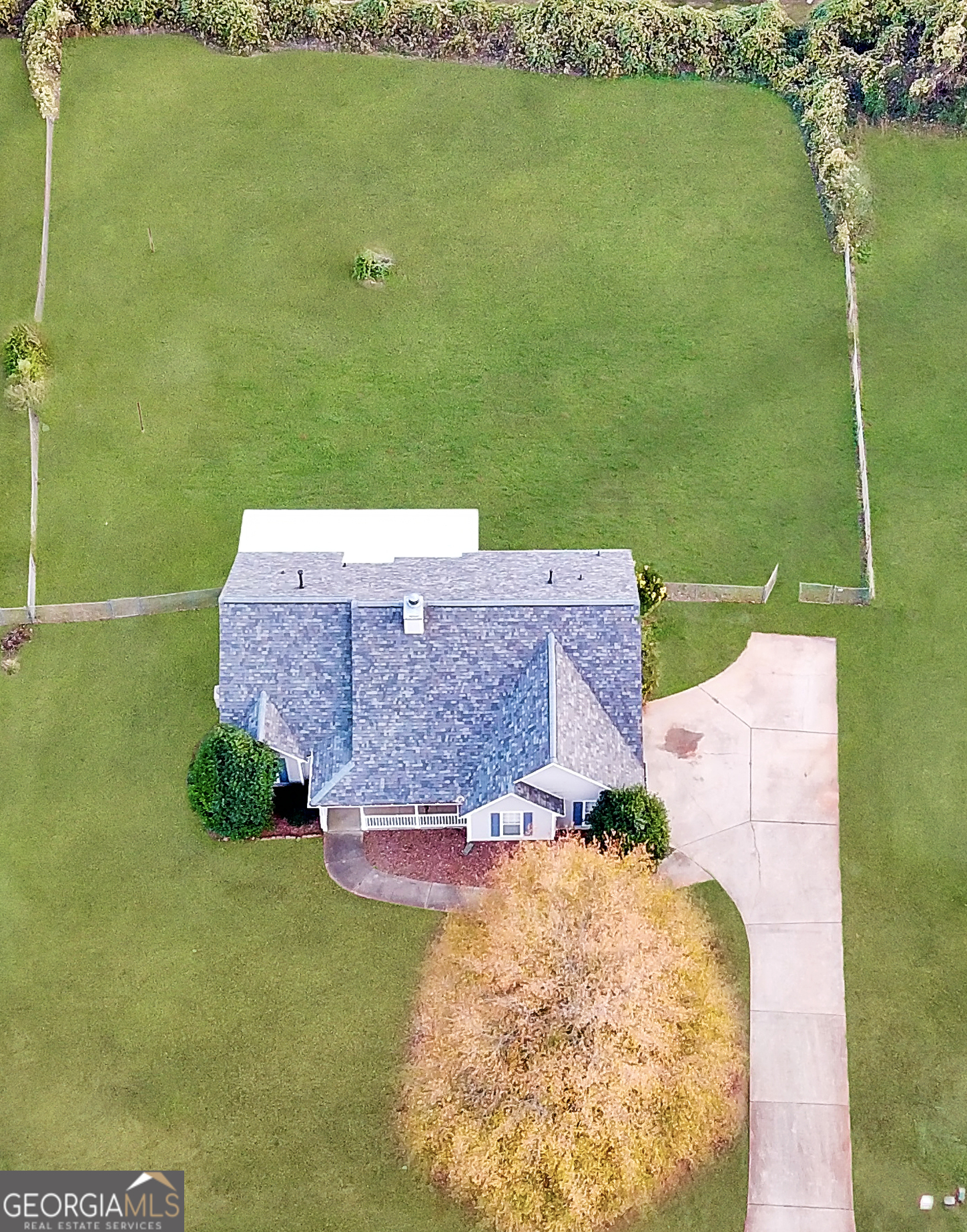 231 Ferguson Avenue Locust Grove, GA 30248 - Photo 23 of 26 a aerial view of a house with a garden
