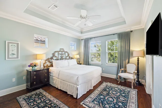 a bedroom with a large bed rug and a window