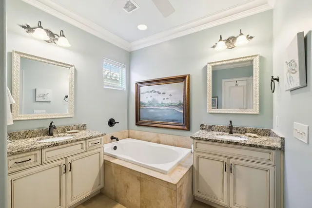 a bathroom with a granite countertop sink mirror and a