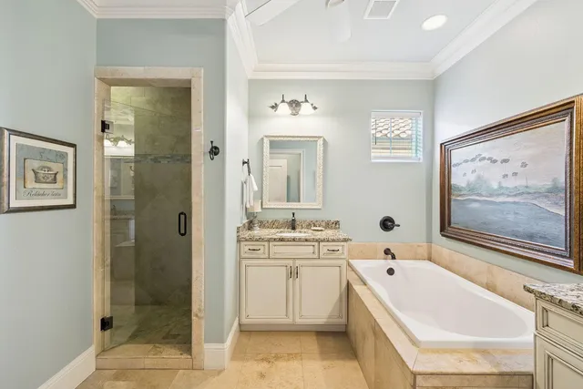 a bathroom with a bathtub sink and mirror