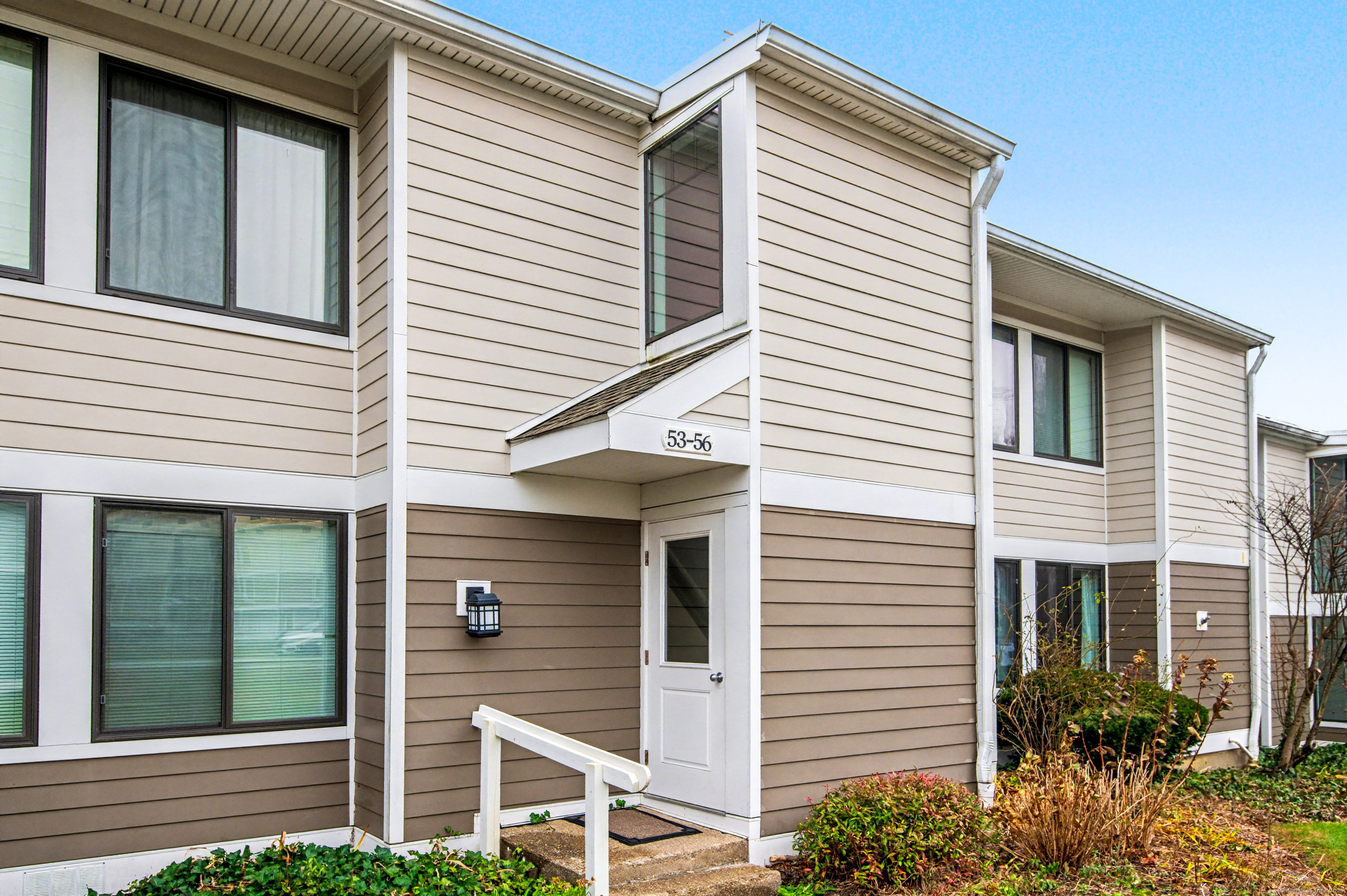 a view of a house with a small porch