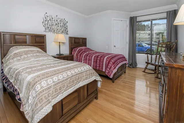 a bedroom with a large bed and a window