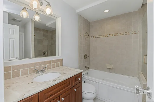 a bedroom with a bed and a view of bathroom