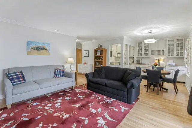 a kitchen with stainless steel appliances granite countertop a stove top oven a sink a counter space and cabinets