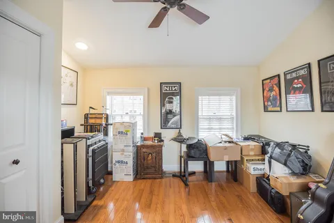 a view of a livingroom with furniture a rug and wooden floor