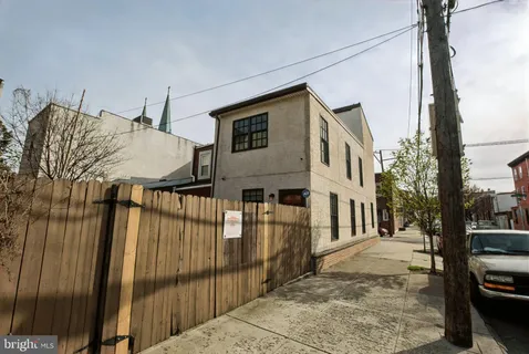 a view of a house with a street
