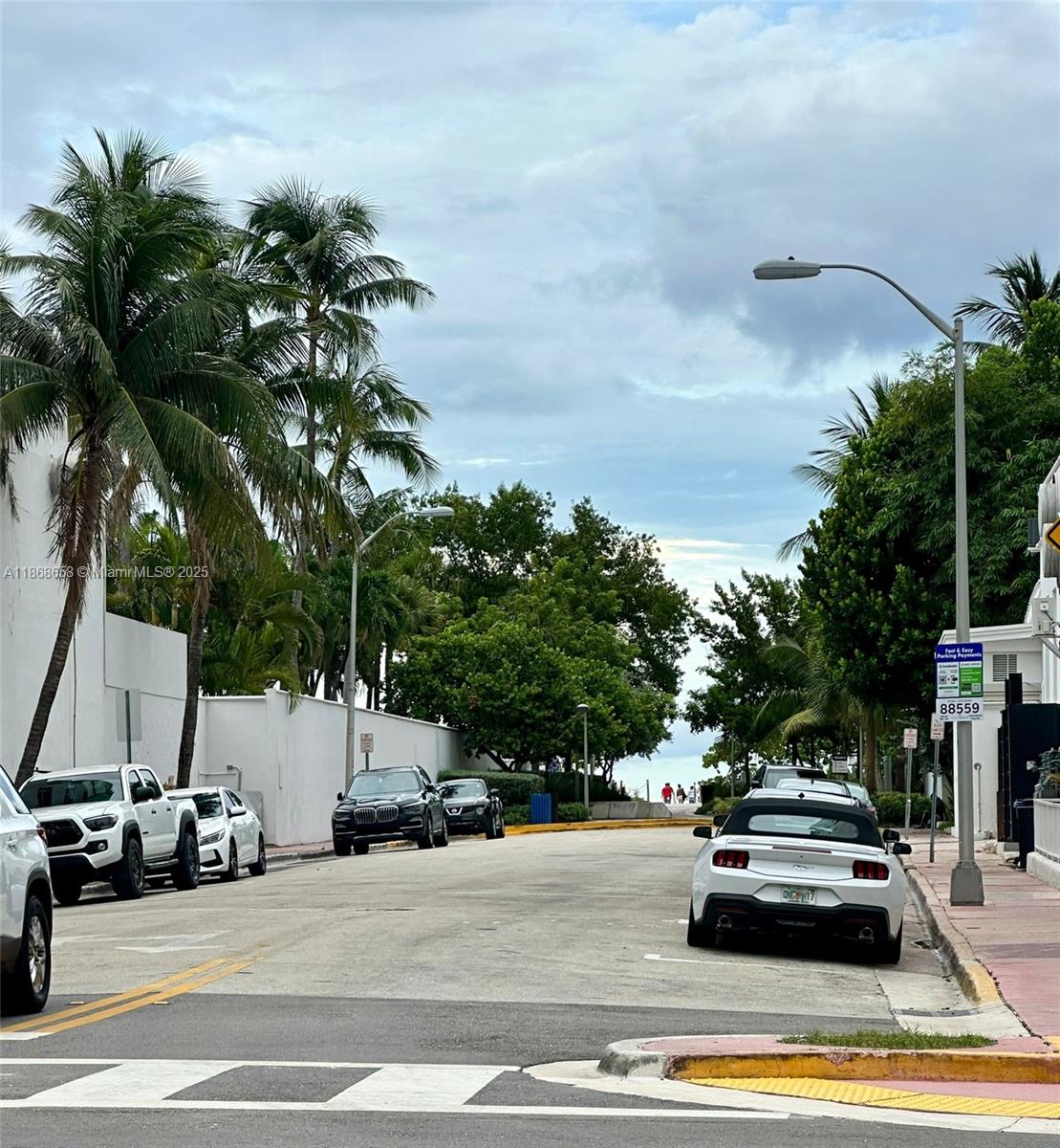 3030 Collins Avenue, Unit 4F Miami Beach, FL 33140 - Photo 20 of 24 a view of street with parked cars