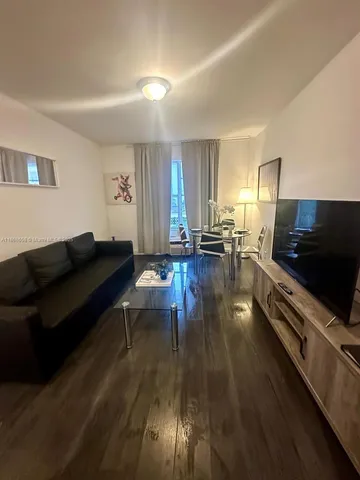 a view of a chairs and table in a patio