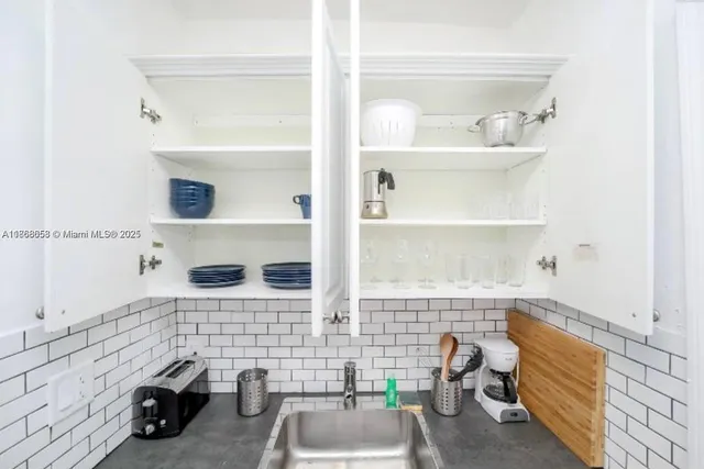 a bathroom with a sink and a window