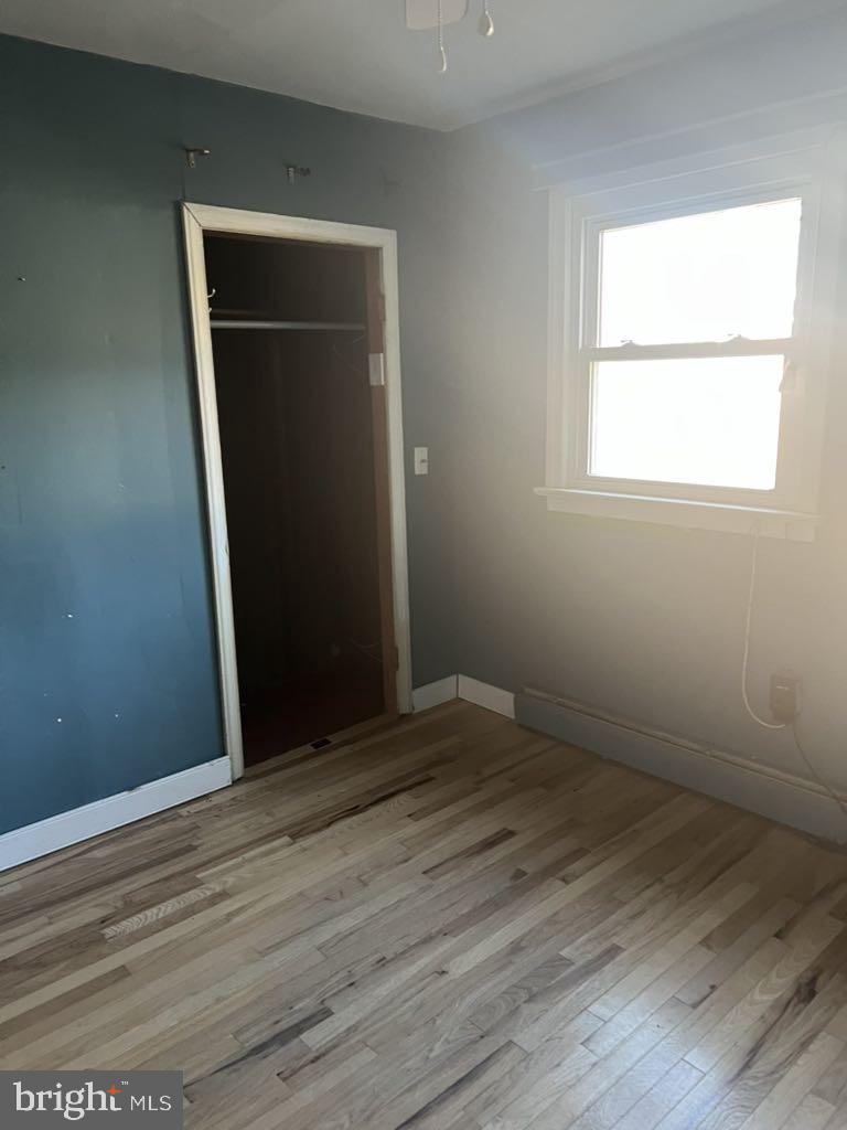 6640 Pomfret Road La Plata, MD 20646 - Photo 13 of 16 an empty room with wooden floor and closet