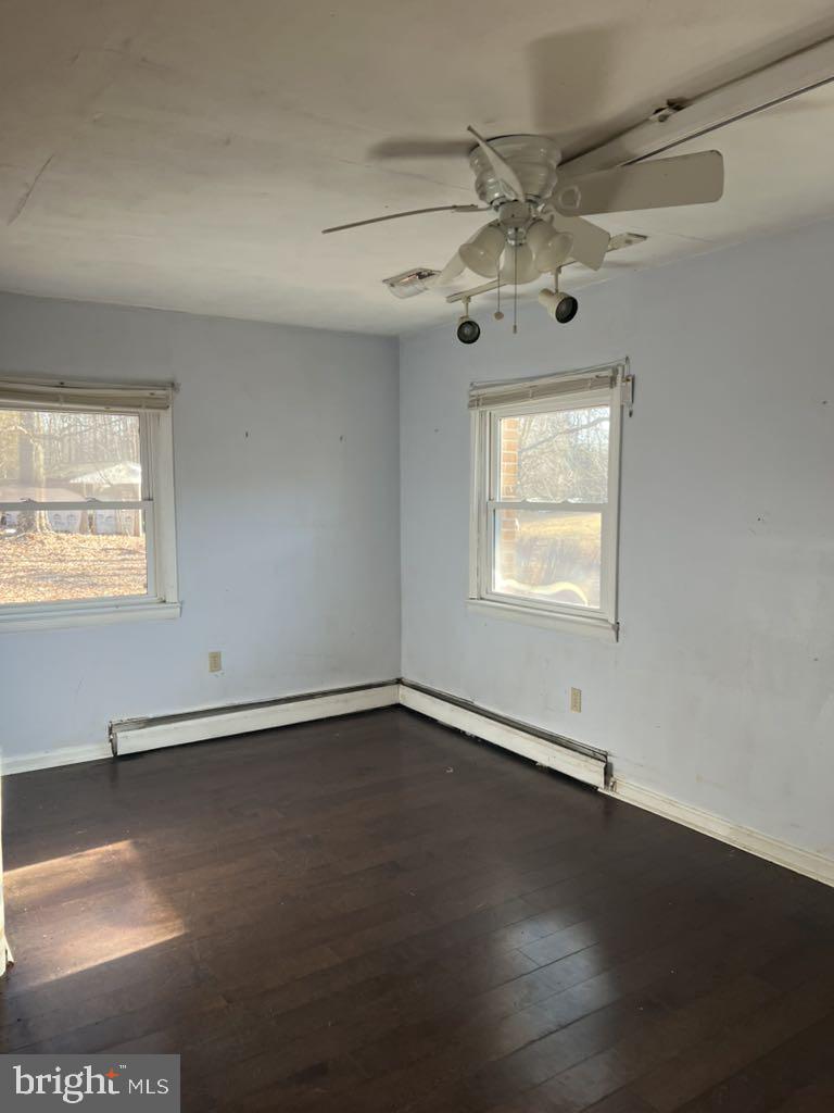 6640 Pomfret Road La Plata, MD 20646 - Photo 9 of 16 an empty room with wooden floor and windows