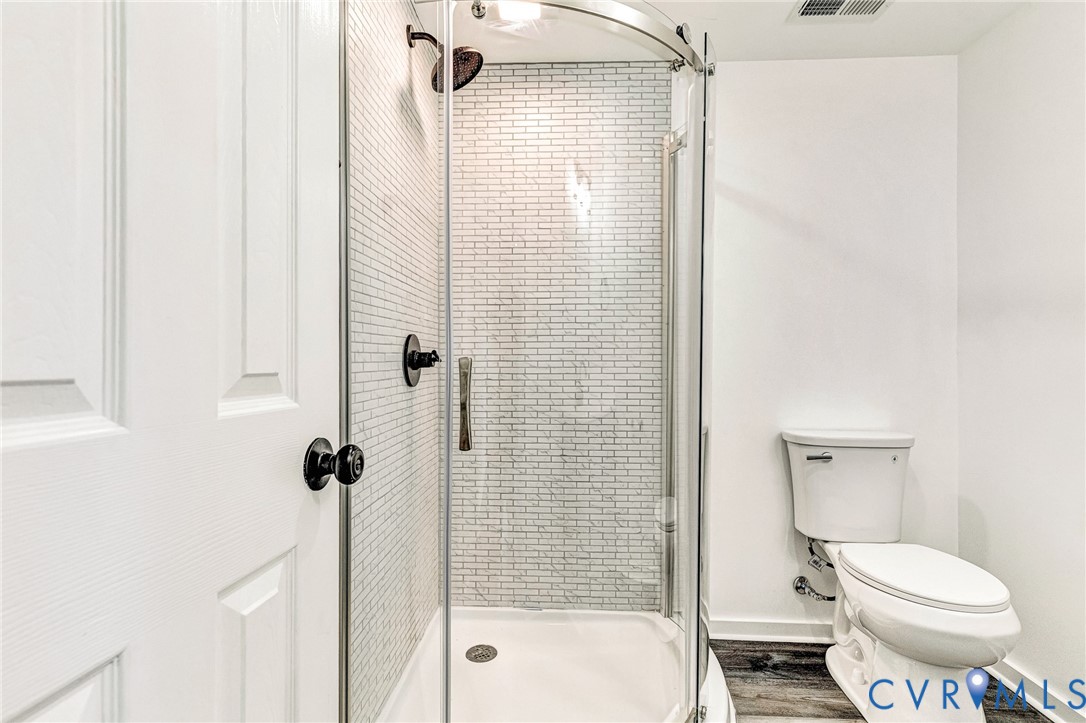 21139 Pendleton Road Bowling Green, VA 22427 - Photo 26 of 41 Modern bathroom featuring a frameless glass-enclos