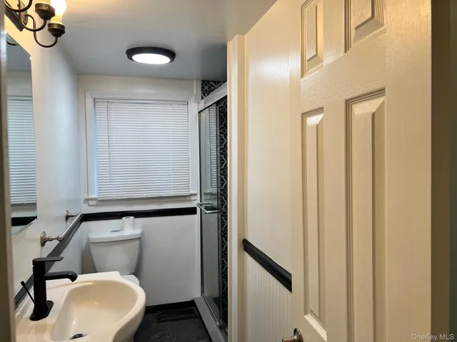a bathroom with a toilet and a sink