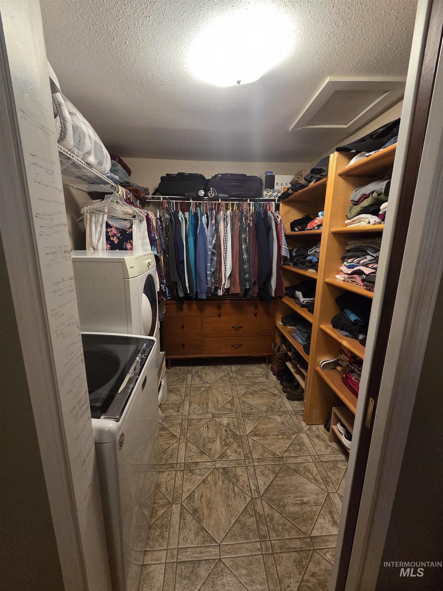 109 South 3rd Street Pomeroy, WA 99347 - Photo 12 of 36 Dedicated laundry area with a top-load washing machine and front-load dryer