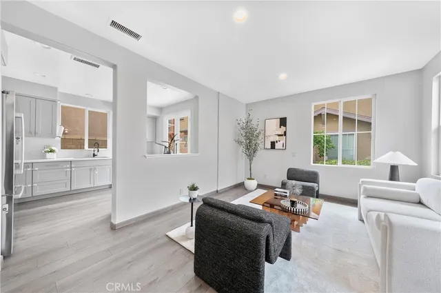 a living room with furniture and windows