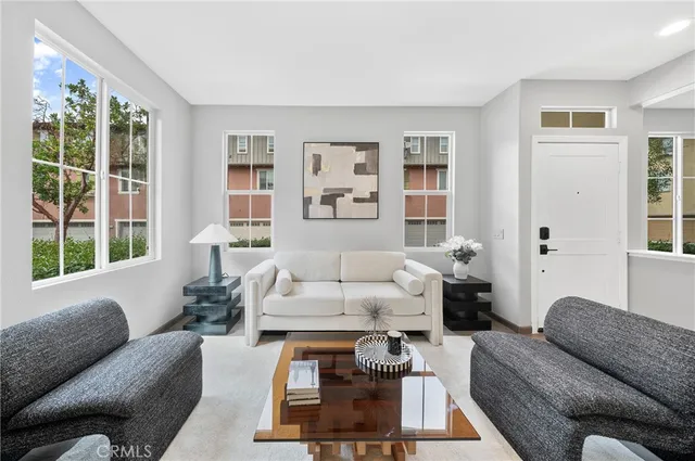a living room with furniture and a large window