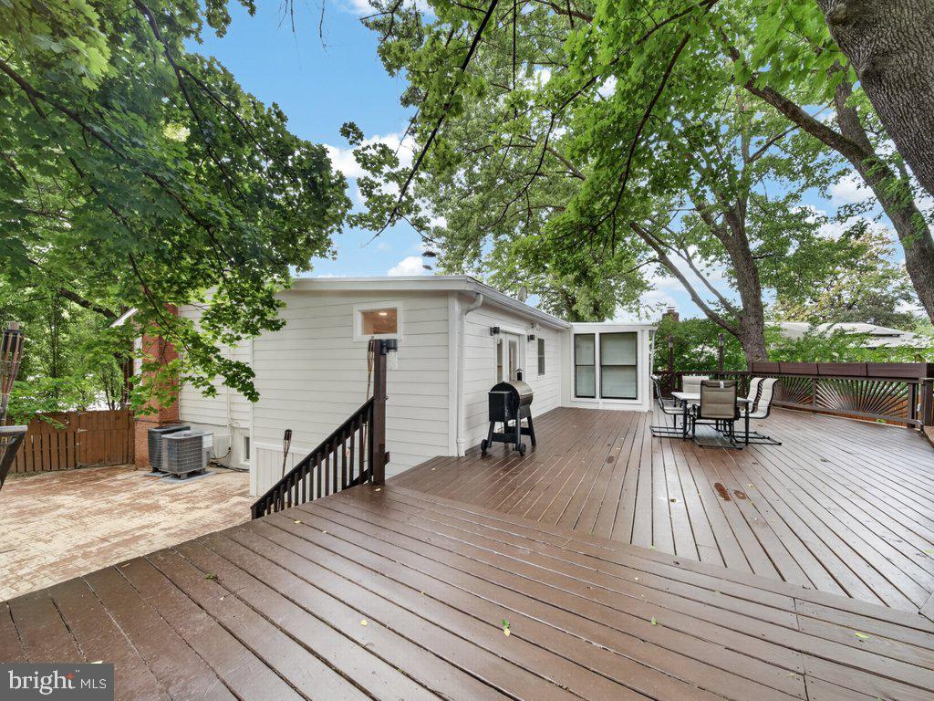 13427 Delaney Road Woodbridge, VA 22193 - Photo 54 of 57 a view of house with deck outdoor seating and yard