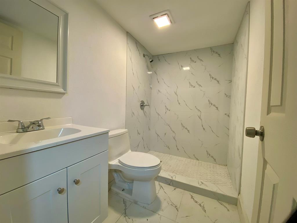 14131 Northwest 3rd Avenue, Unit C Miami, FL 33168 - Photo 1 of 7 a bathroom with a sink toilet and shower