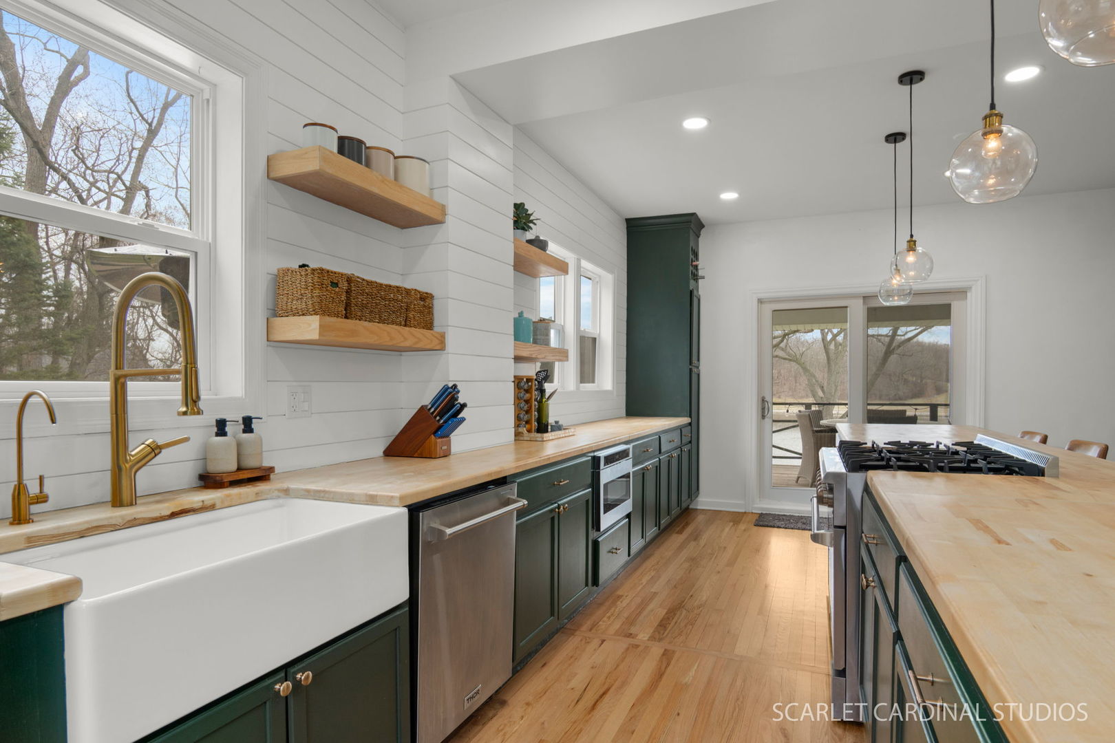 705 Spring Beach Way Cary, IL 60013 - Photo 2 of 32 a kitchen that has a lot of cabinets in it and wooden floors