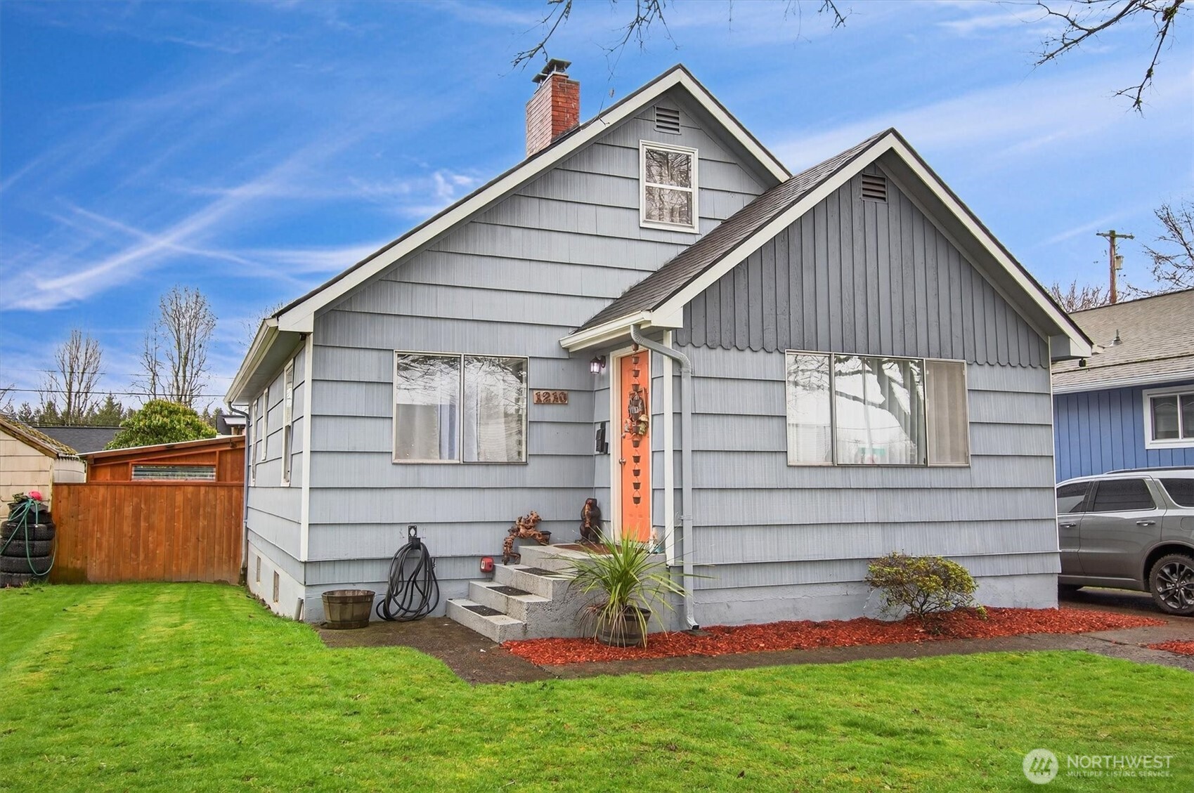 a view of backyard with a garden and deck