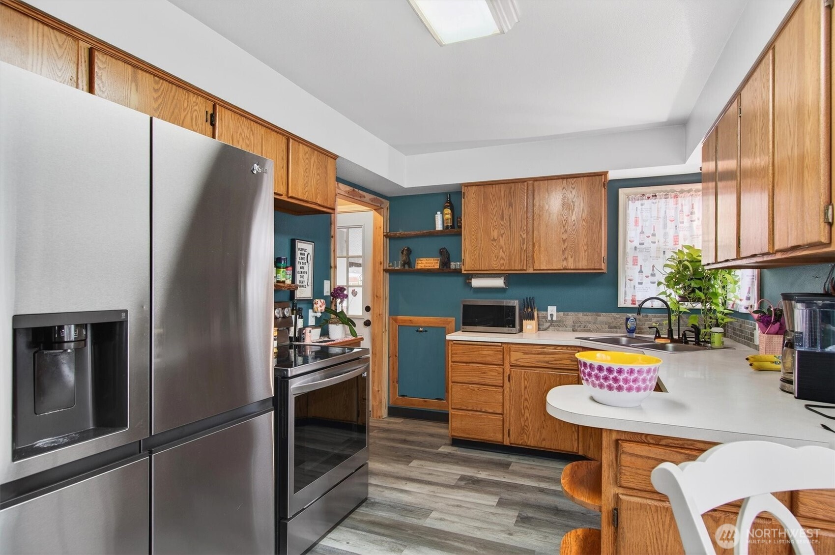 1210 8th Avenue Longview, WA 98632 - Photo 11 of 37 a kitchen with stainless steel appliances granite countertop a refrigerator and a stove