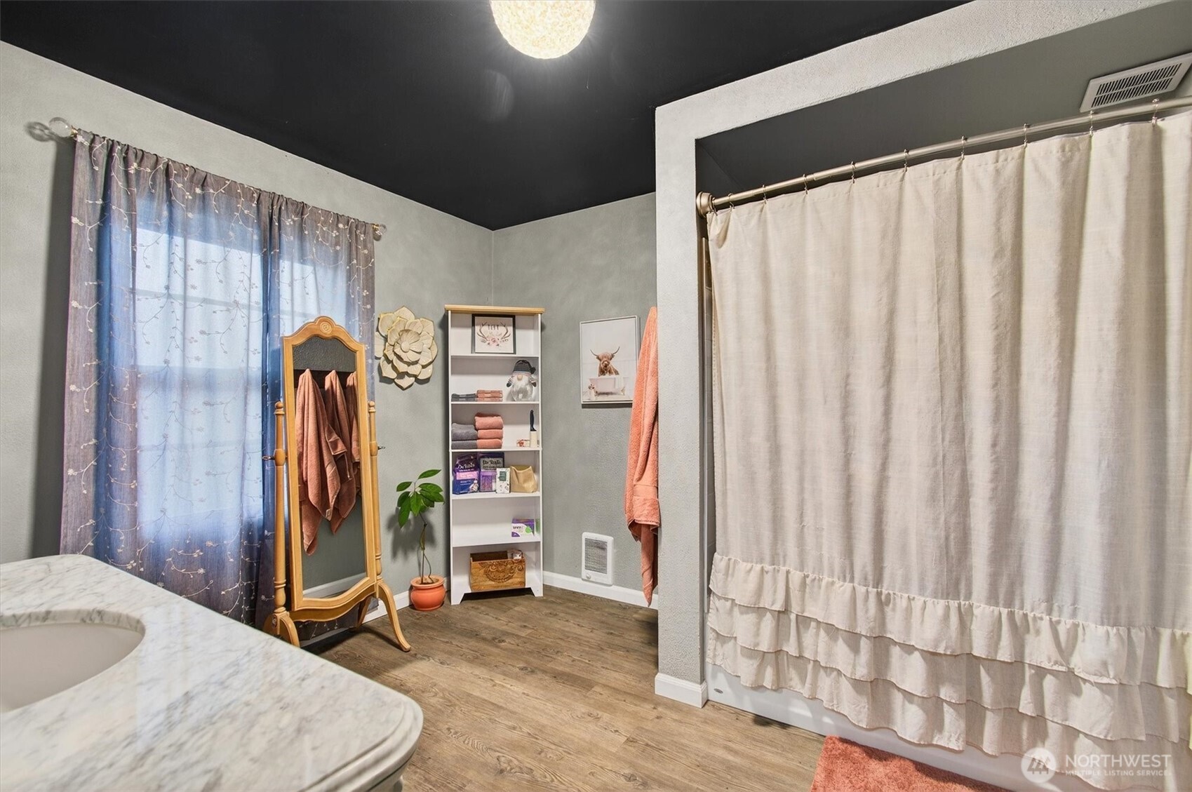 1210 8th Avenue Longview, WA 98632 - Photo 15 of 37 a view of walk in closet with clothes and shoes