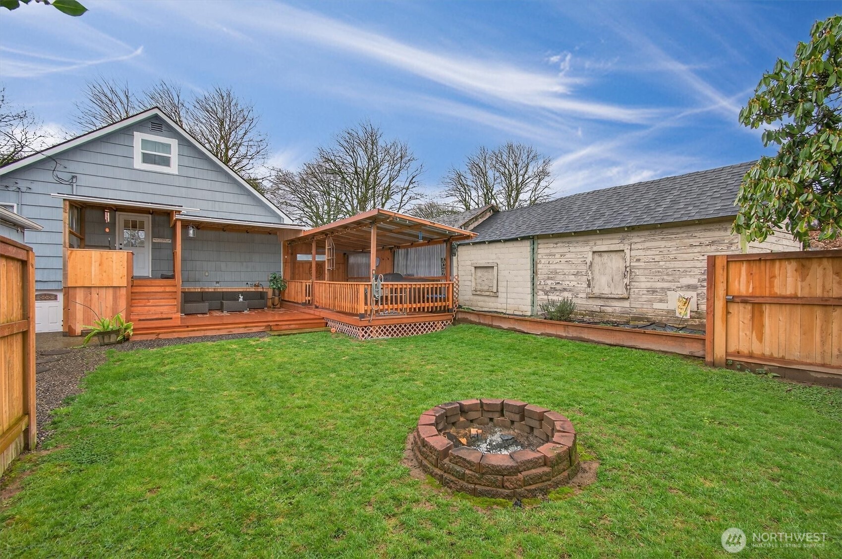 1210 8th Avenue Longview, WA 98632 - Photo 36 of 37 a backyard of a house with table and chairs