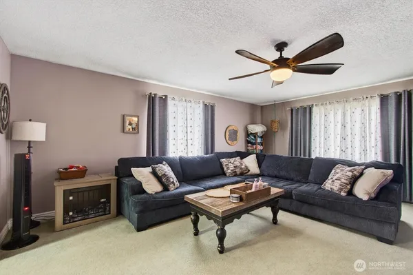 a living room with furniture and a window