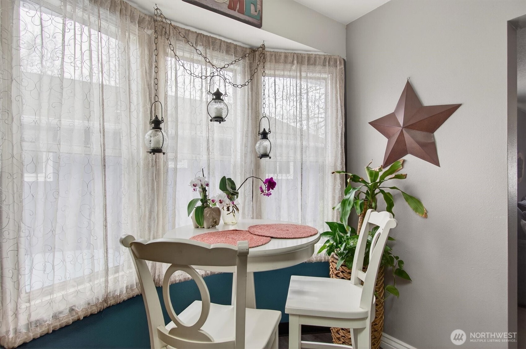 1210 8th Avenue Longview, WA 98632 - Photo 9 of 37 a view of a dining room with furniture window and wooden floor