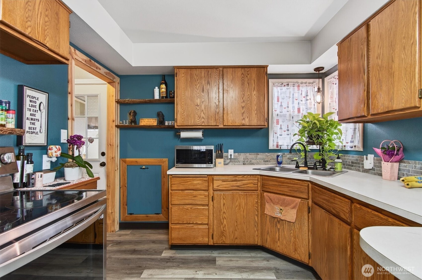 1210 8th Avenue Longview, WA 98632 - Photo 10 of 37 a kitchen with sink cabinets and window
