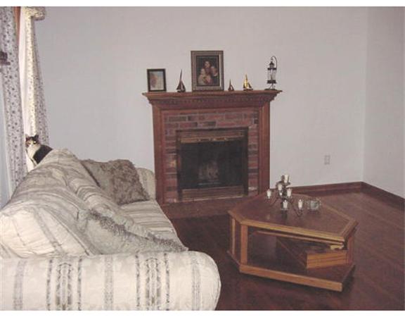 13 Allen Road Sturbridge, MA 01566 - Photo 4 of 16 a bedroom with a bed and a fireplace