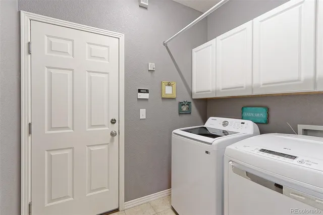 a view of storage and utility room with washer and dryer