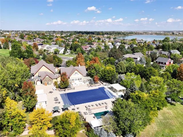 an outdoor living area with furniture and garden view