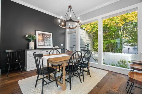 a view of a dining room with furniture window and wooden floor