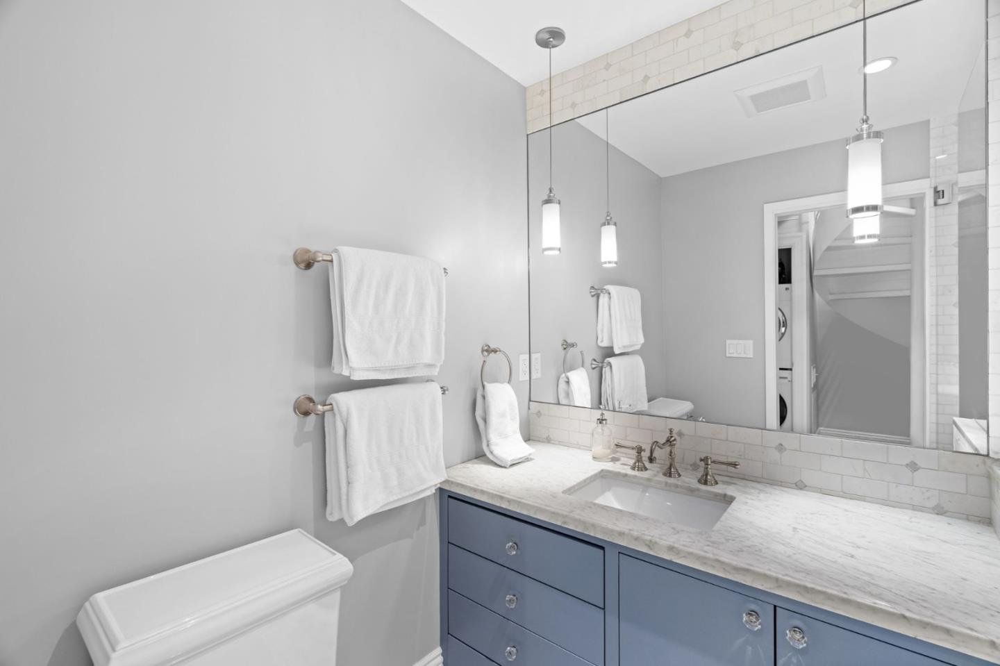 112 27th Street San Francisco, CA 94110 - Photo 19 of 28 a bathroom with a granite countertop sink mirror and a toilet