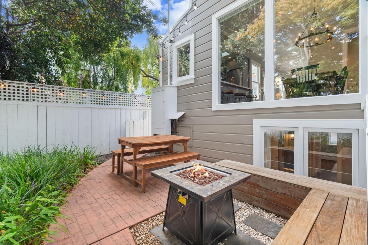 112 27th Street San Francisco, CA 94110 - Photo 23 of 28 a wooden bench sitting in front of a building