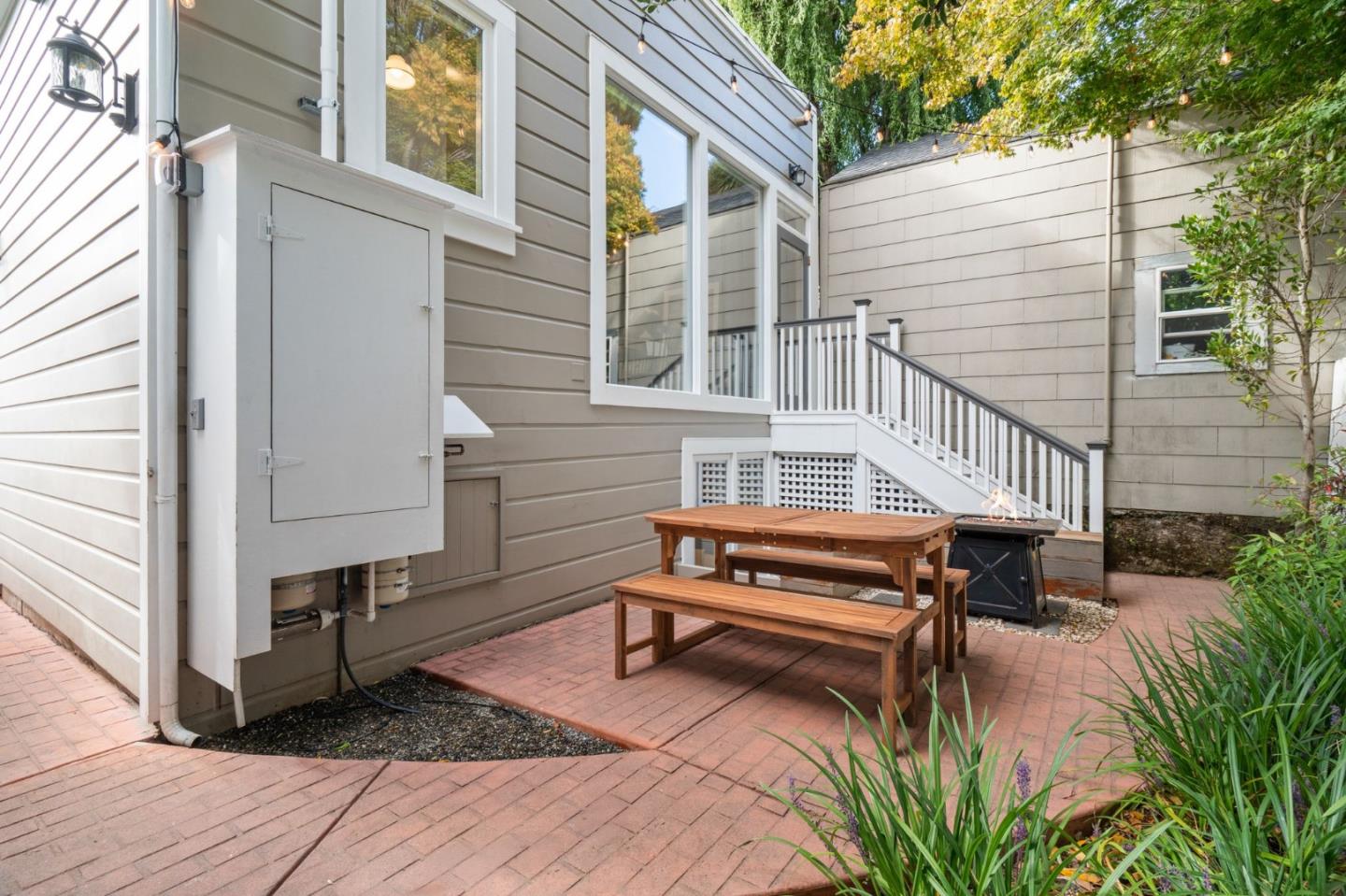 112 27th Street San Francisco, CA 94110 - Photo 24 of 28 a backyard of a house with barbeque oven and outdoor seating