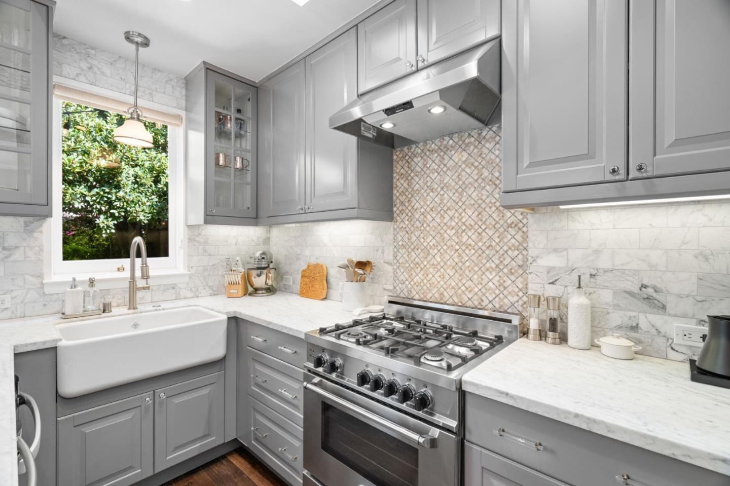 112 27th Street San Francisco, CA 94110 - Photo 9 of 28 a kitchen with a sink stove and cabinets