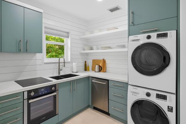 321 South Swinton Avenue Delray Beach, FL 33444 - Photo 16 of 30 a kitchen with a sink a stove and cabinets
