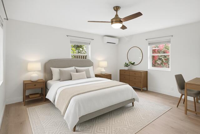 321 South Swinton Avenue Delray Beach, FL 33444 - Photo 17 of 30 a spacious bedroom with a bed a dresser with chair and bathroom