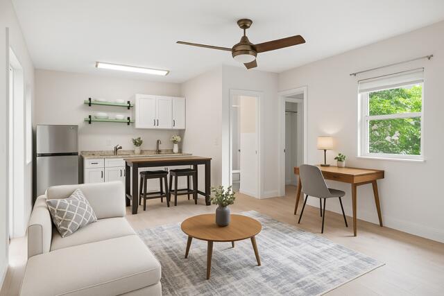 321 South Swinton Avenue Delray Beach, FL 33444 - Photo 20 of 30 a living room with furniture a window and a table