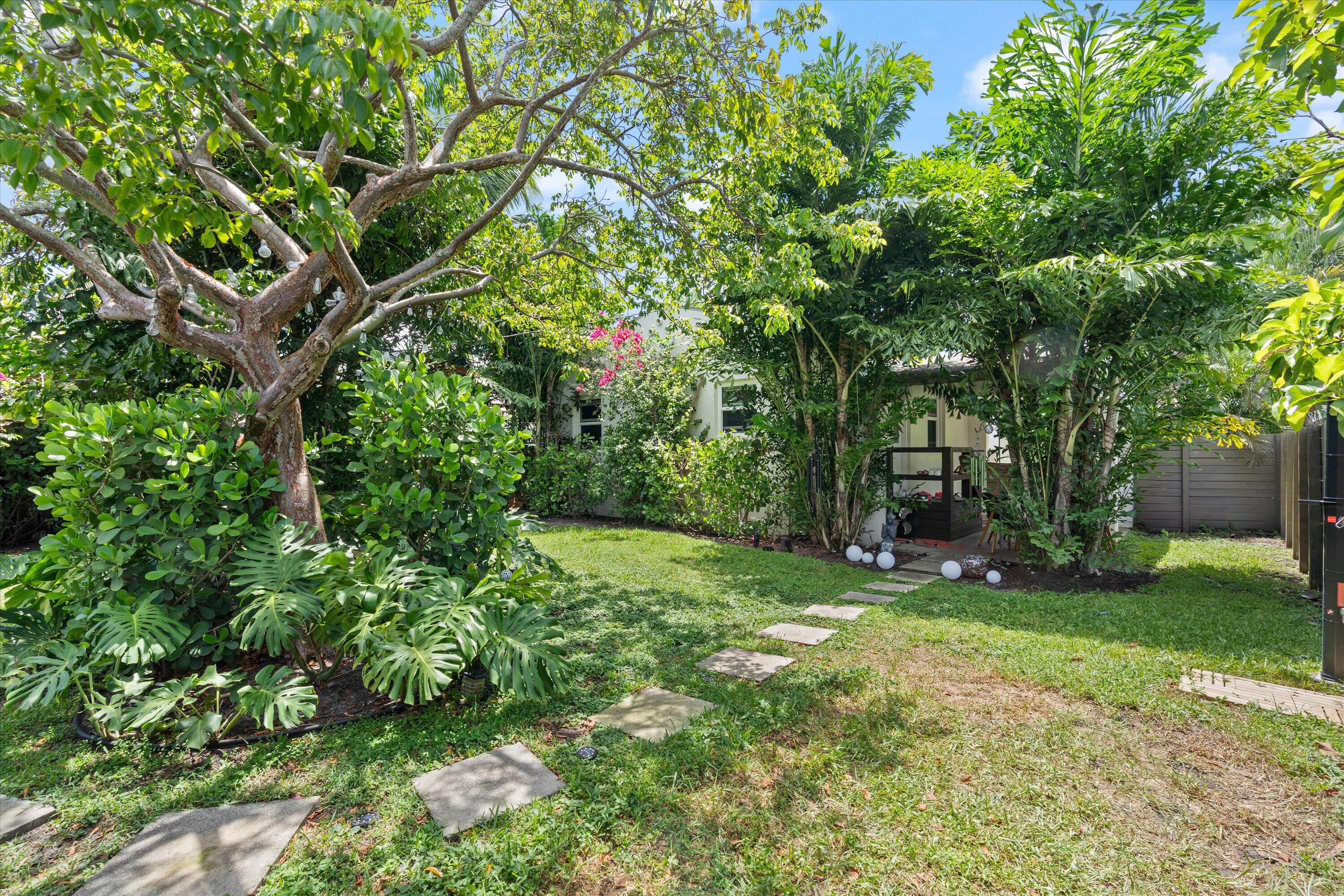 321 South Swinton Avenue Delray Beach, FL 33444 - Photo 5 of 30 a green field with lots of trees in it