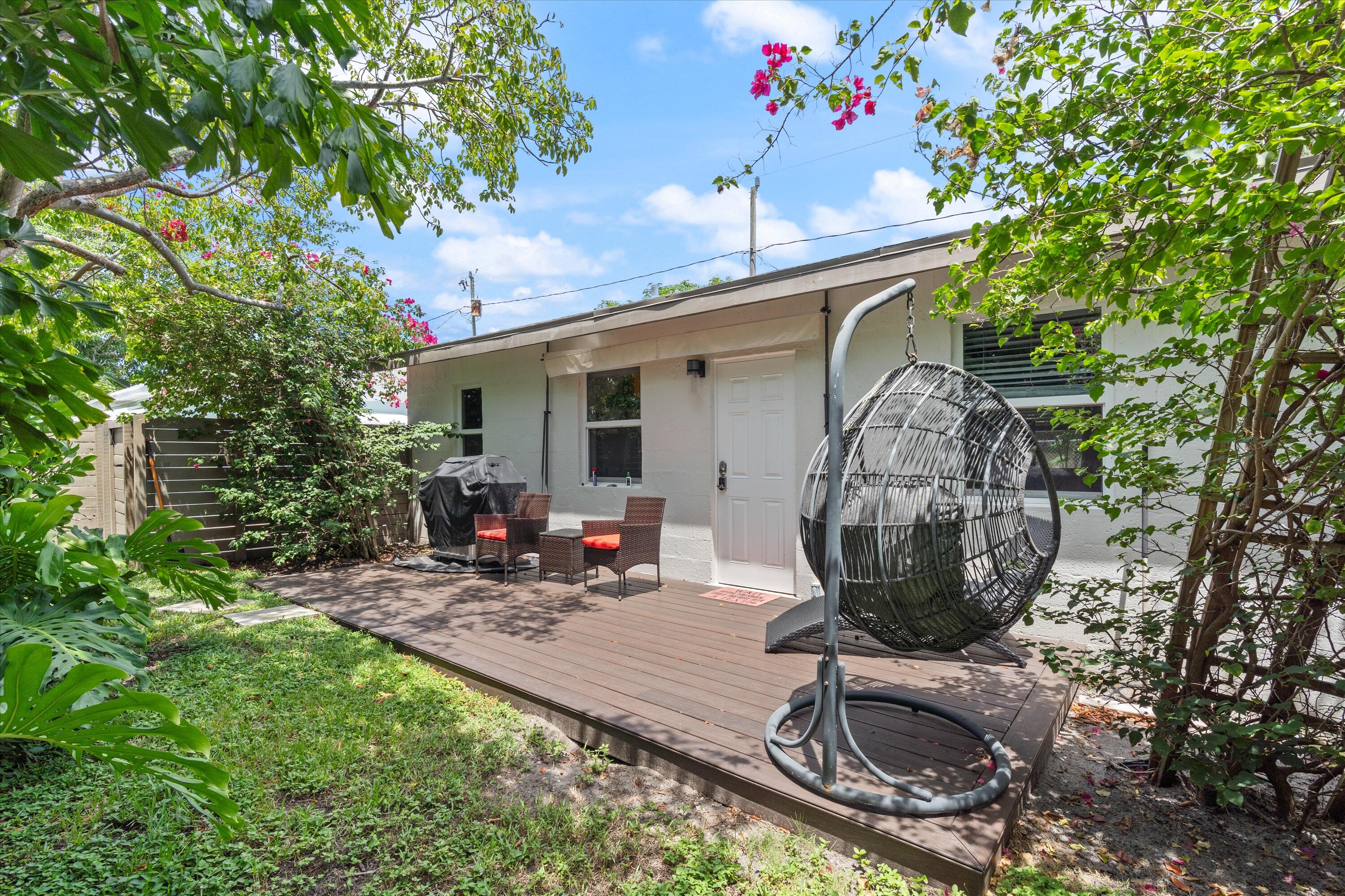 321 South Swinton Avenue Delray Beach, FL 33444 - Photo 8 of 30 a view of a chair and table in backyard