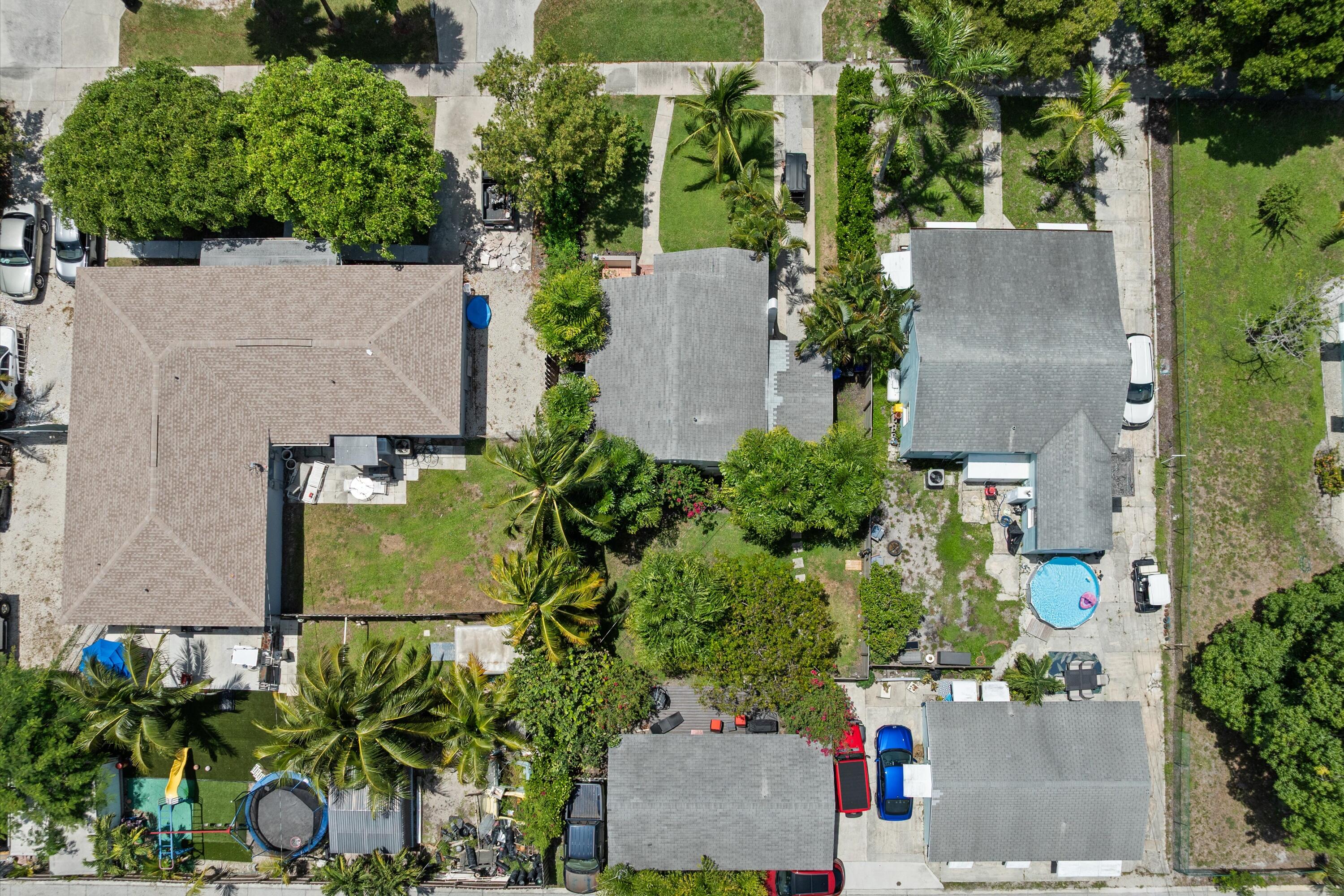 321 South Swinton Avenue Delray Beach, FL 33444 - Photo 10 of 30 an aerial view of a house with a yard and a fountain