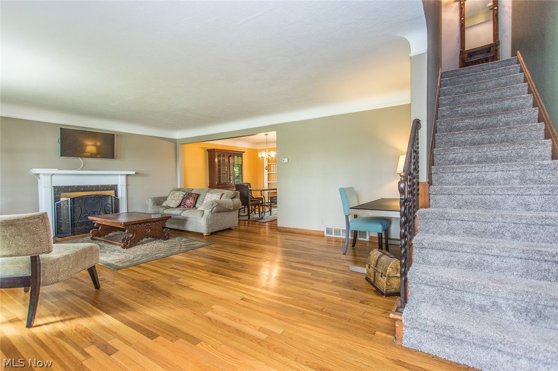 1092 Ford Road Lyndhurst, OH 44124 - Photo 2 of 22 The large, open living room with beautiful hardwood floors welcomes you into this special home.